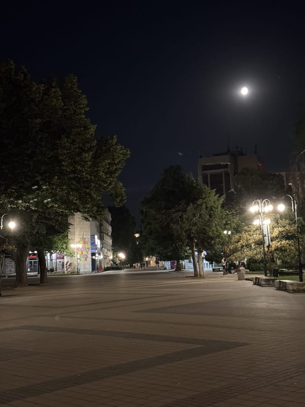 Lovech at night: full moon over fortress and Levski statue