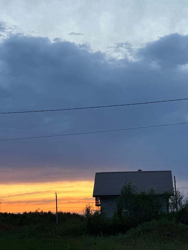 Sunset silhouettes house in Прикамский, Russia evening scene