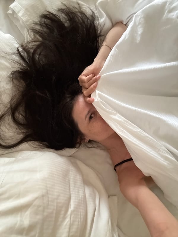 Woman resting in bed observed in Safaga, Egypt