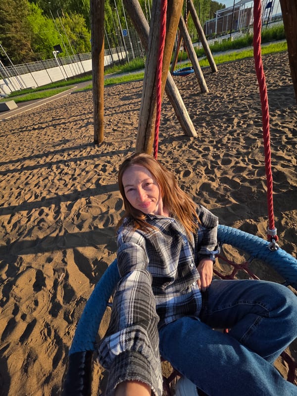 Woman enjoys sunset playground visit along Kama River in Russia