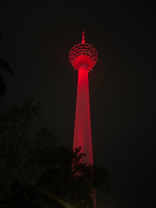 KL Tower glows red in Kuala Lumpur night sky