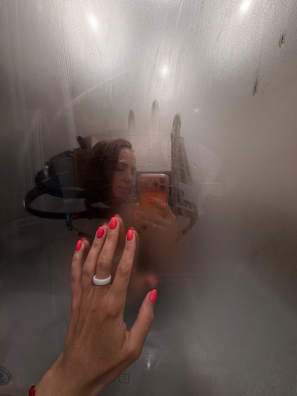 Person touches steamy glass surface in Birobidzhan, Russia