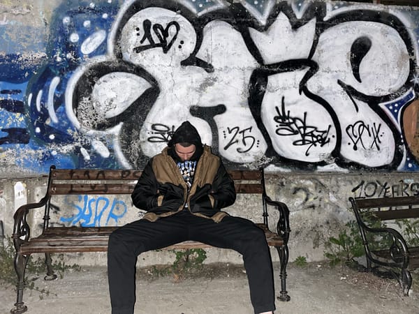 Solitary figure sits on bench in Burgas, Bulgaria
