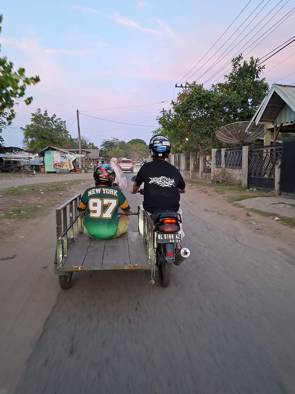 Evening street scene captured in Lhokseumawe residential area