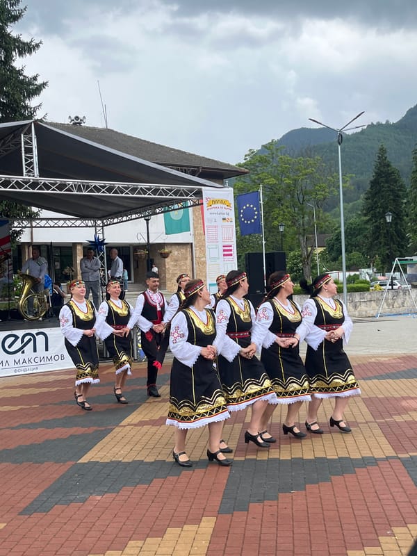 Traditional dance festival with market stalls documented in mountainous valley