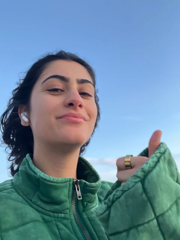 Woman takes selfies near historic tower in Porto