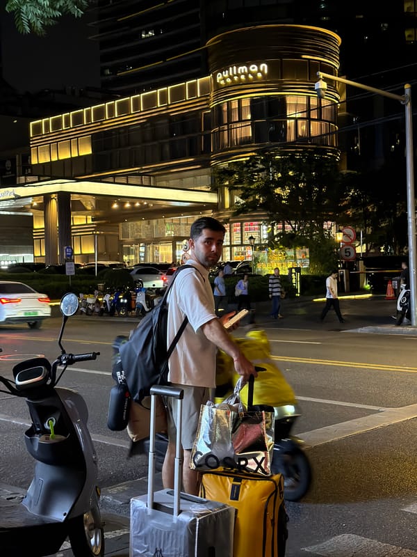 Nighttime street scene captured near Pullman Hotel in Shanghai