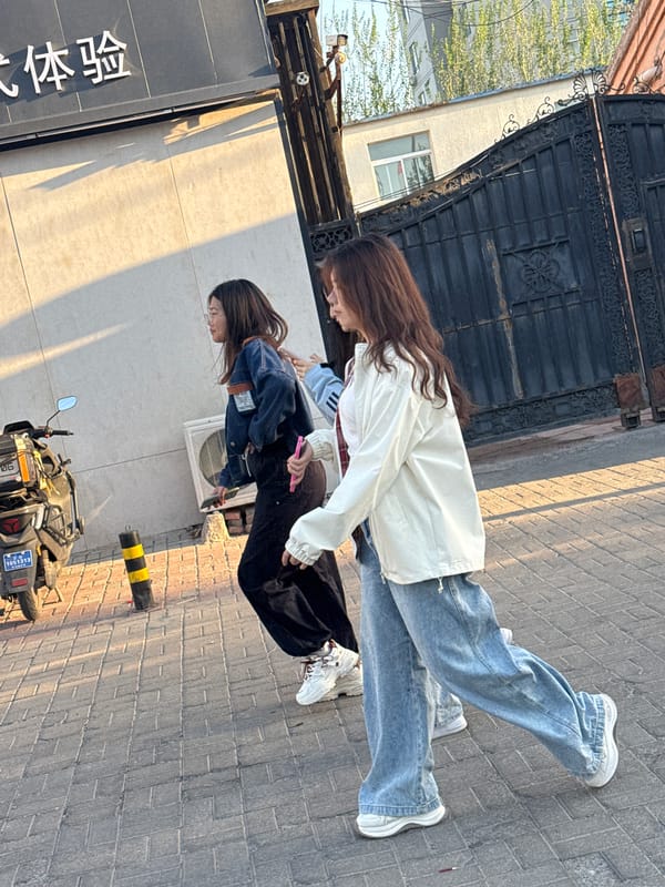 Young women photographed on sunny Zhongtun streets