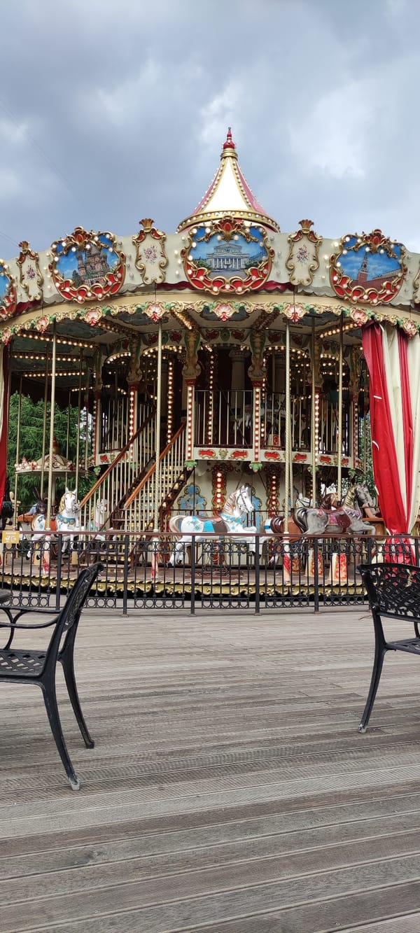 Ornate carousel and garden seating at a Moscow outdoor venue