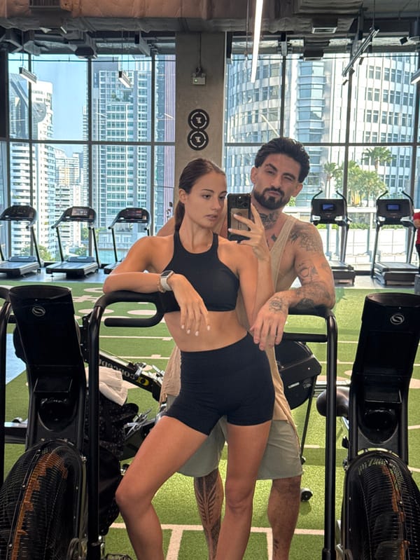 Couple photographs workout session at Bangkok high-rise gym
