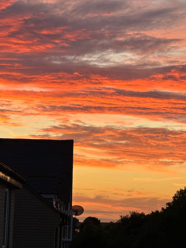 Bright summer sunset over Great Yarmouth rooftops