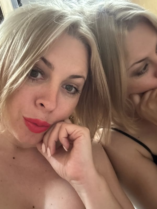 Selfie session in Sochi with bold lips and a red flower accessory