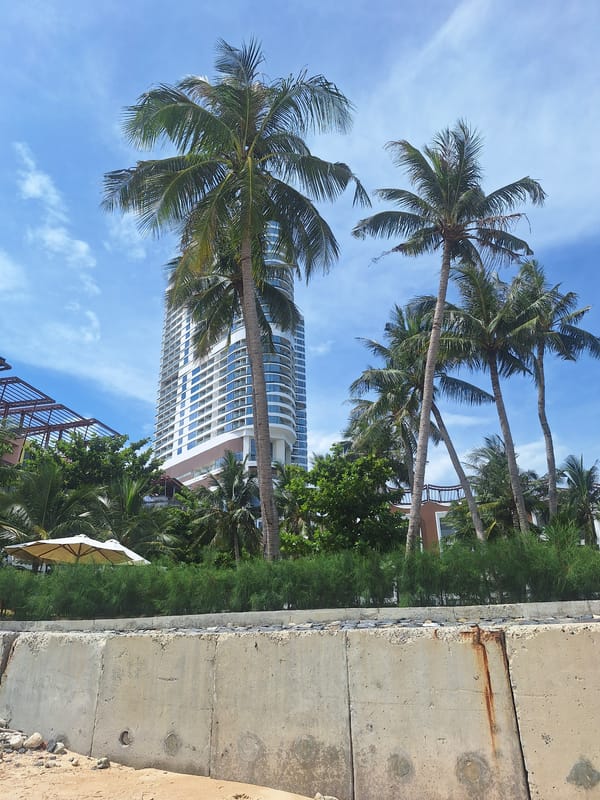 Nha Trang coastline: rocks, calm sea, and a beachfront resort