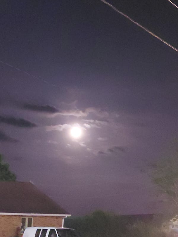 Full moon rising over Nicholasville, partly veiled by clouds