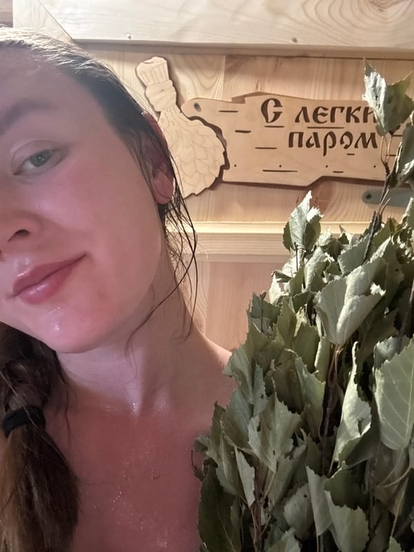 Woman takes selfie in Russian sauna