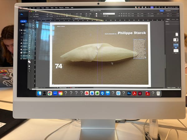 Design studio workspace documented in Milan featuring iMac