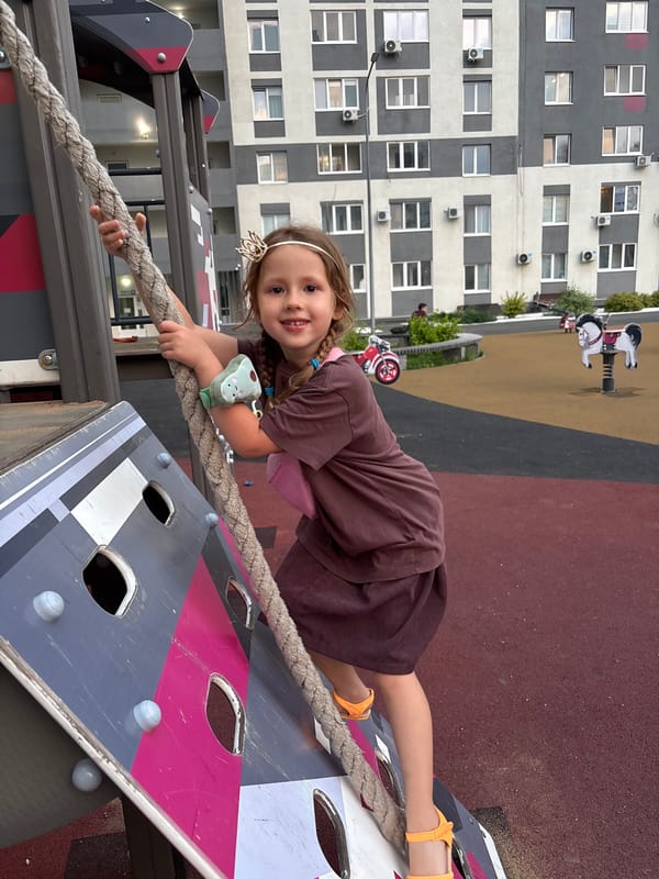 Rope climbing at an outdoor playground in Orenburg, Russia.