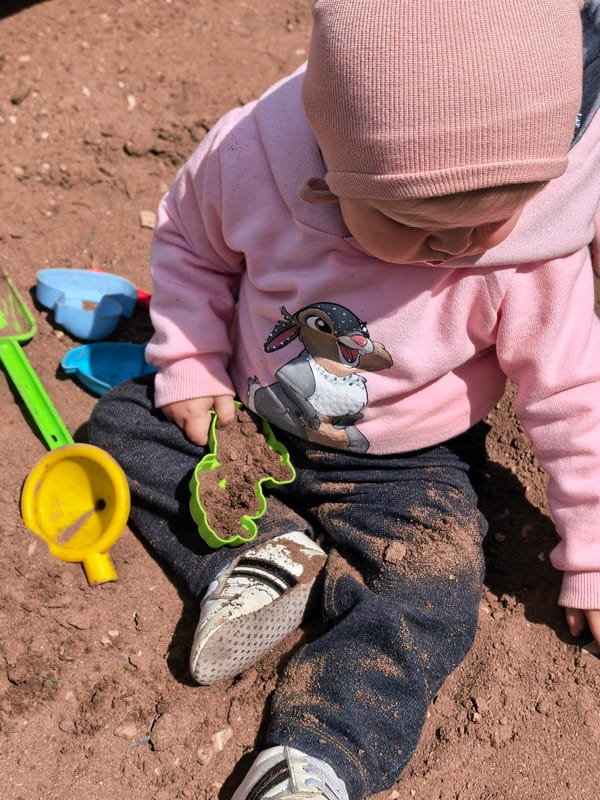 Mother and toddler enjoy morning playground time in Sterlitamak