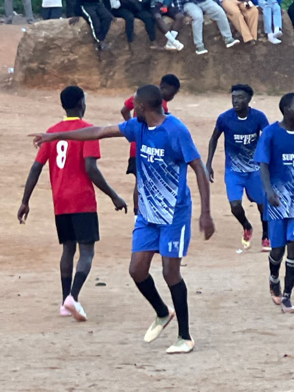 Pickup football in Jos, rocks serving as the stands