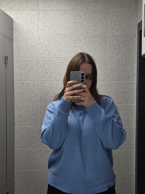 Bathroom selfie and pushpin heart art captured simultaneously