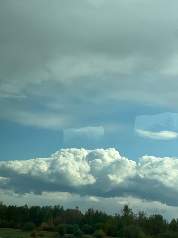Cumulus clouds observed over rural Russia landscape