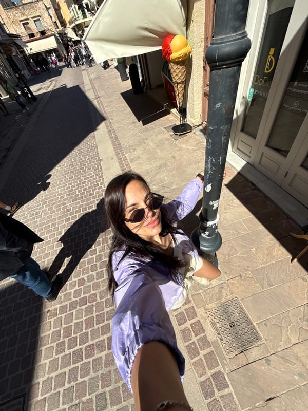 Tourist documents morning stroll through historic Chania waterfront district