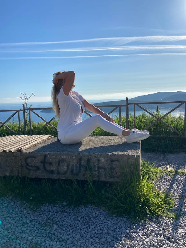 Woman photographs afternoon outing at Montenegro scenic overlook
