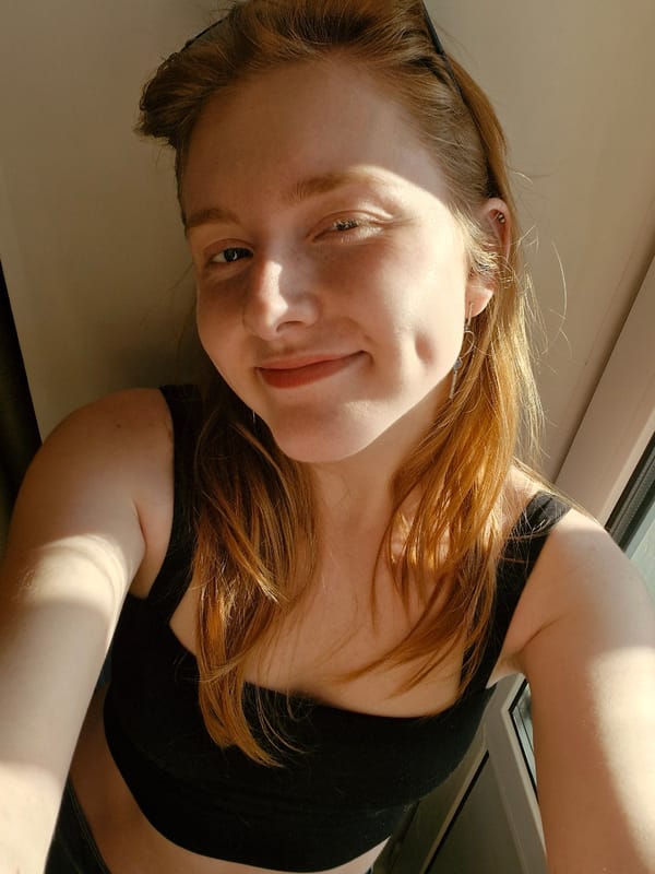 Red-haired woman photographed smiling in Yekaterinburg