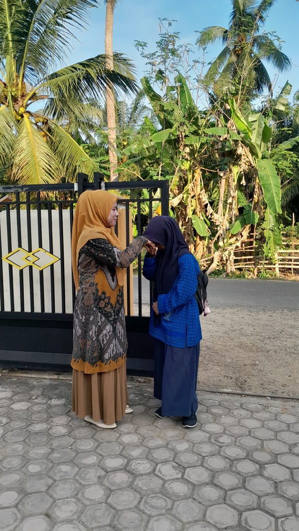 Traditional greeting ceremony between two women in Blangriek, Indonesia