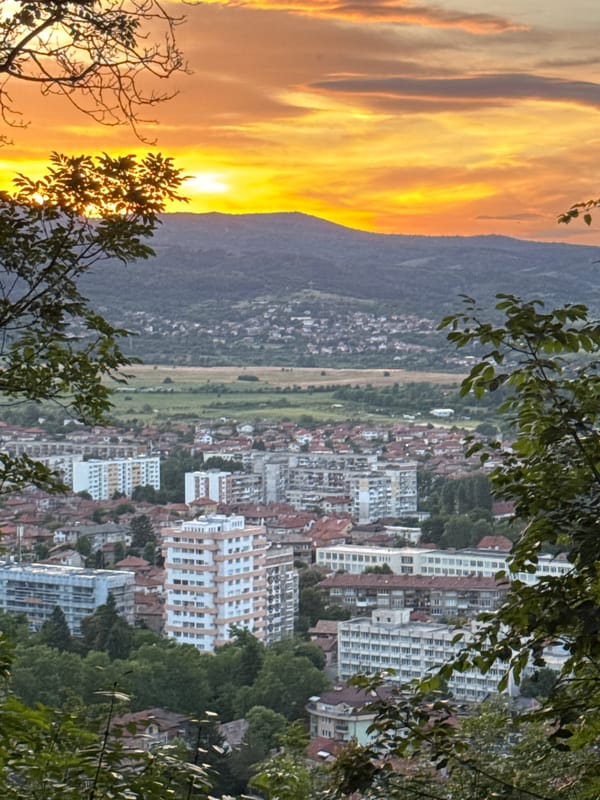 Sunset documented over mountain-divided city on May 30
