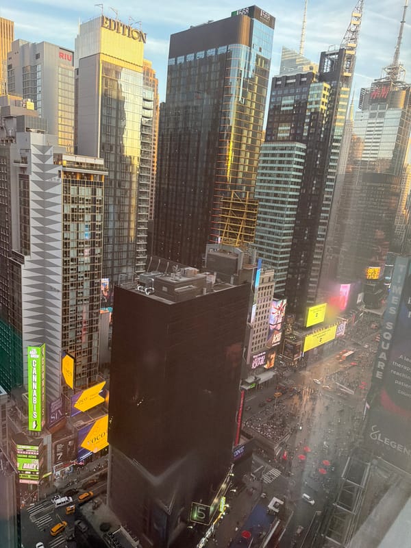 Aerial views document nighttime Manhattan cityscape from Times Square