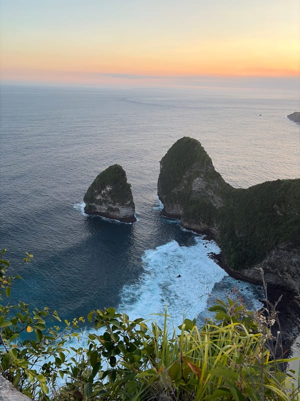 Sunset views across Kelingking Beach's dramatic cliffs, Nusa Penida