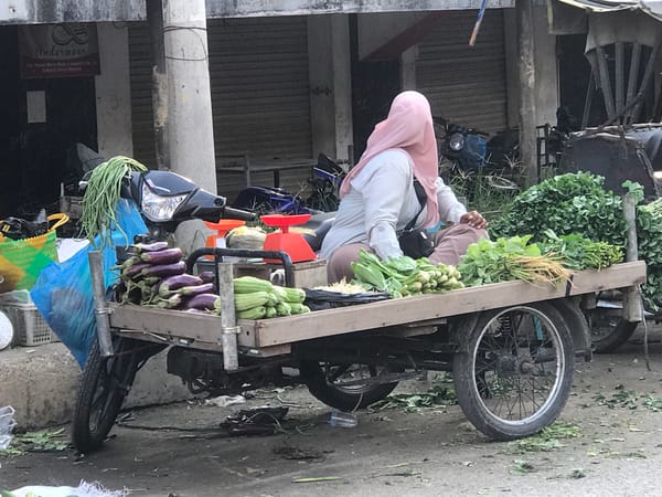 Street vendors active near mosque in Langsa, Indonesia