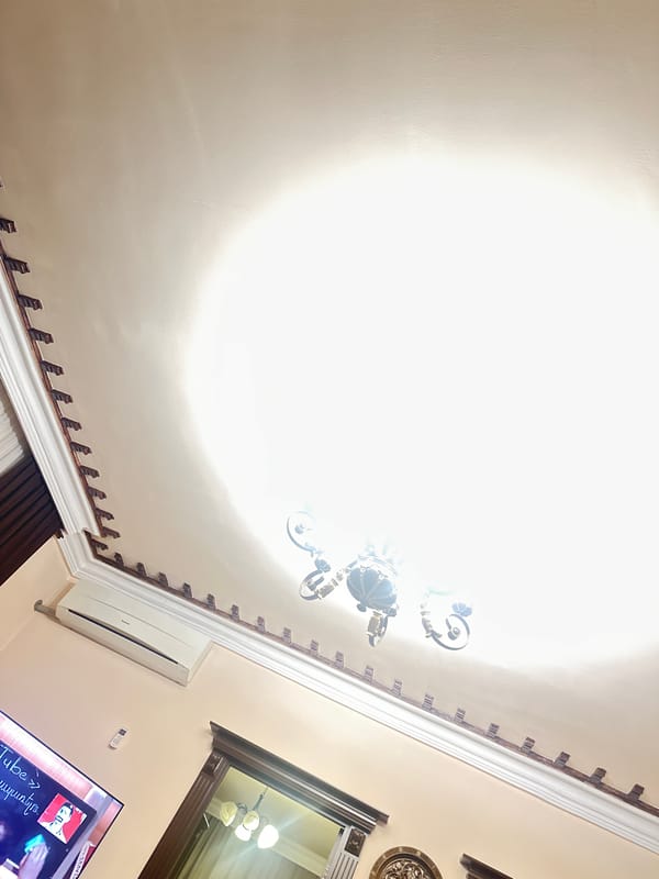 Evening television viewing documented in Yerevan residential interior