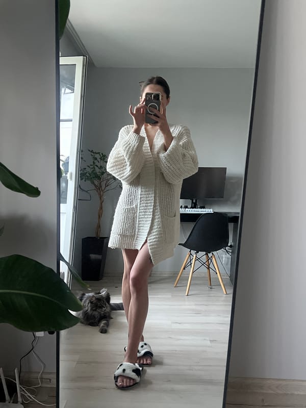 Person takes late-night mirror selfie with cat in Ternopil