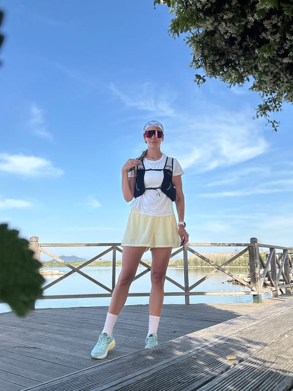 Woman photographs herself with geese at Fethiye lagoon boardwalk