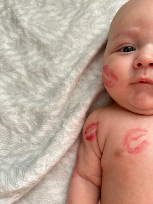Baby photographed with lipstick kisses in Ufa, Russia