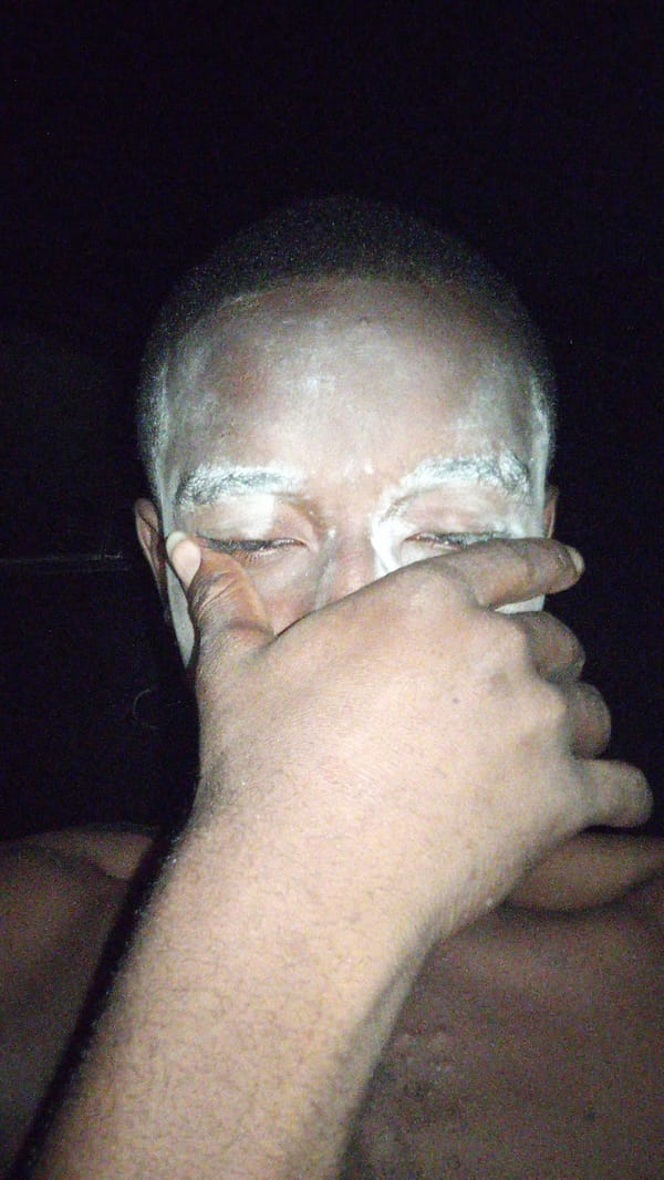 Evening life documented across Onitsha: phones, rest, street vendors