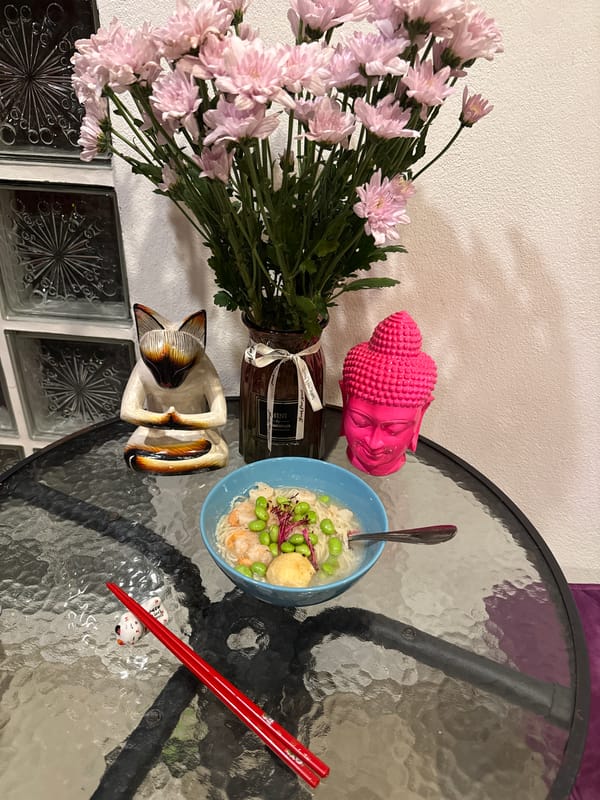 Ramen dinner documented with decorative table setting in Thailand