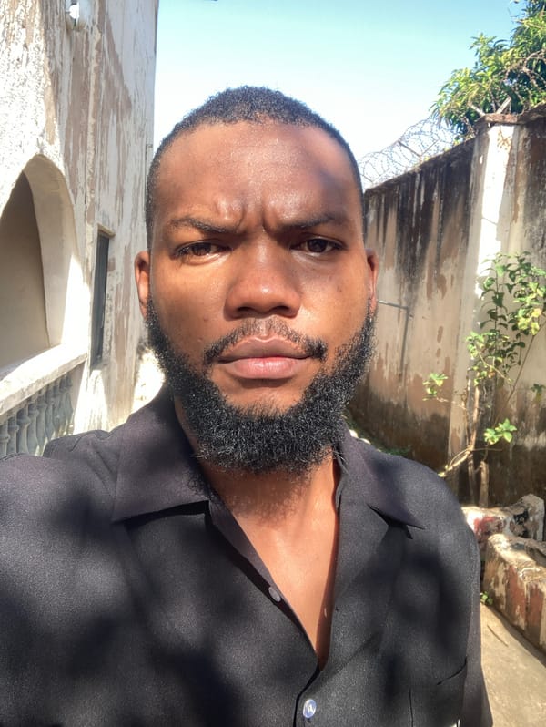 Man in black shirt observed outdoors in Jos, Nigeria