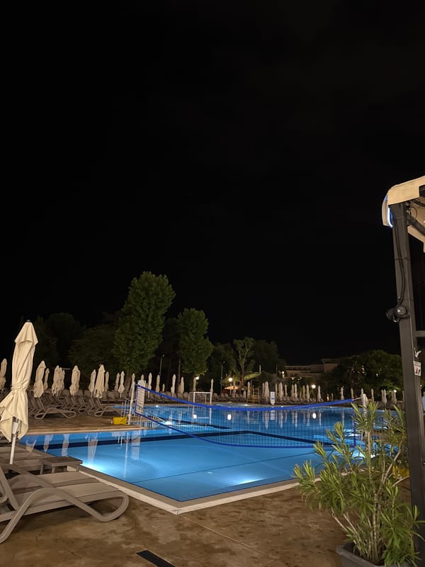 Evening documentation of quiet hotel resort with pools, buildings
