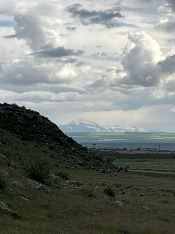 Group gathers at stone structure on Armenian hillside