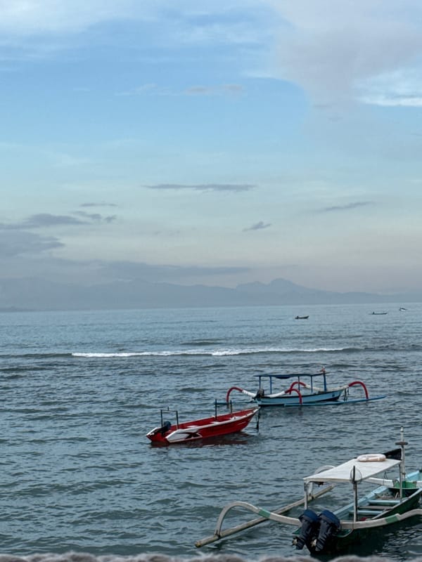 Overcast seascape with boats observed near Denpasar, Indonesia