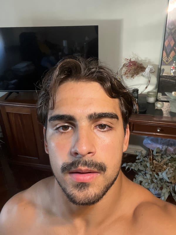 Man photographed indoors in Buenos Aires home setting