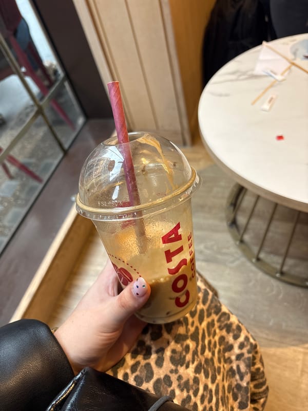Woman enjoys Costa iced coffee in London