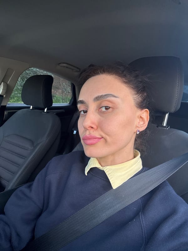 Woman photographed in car interior in Tbilisi