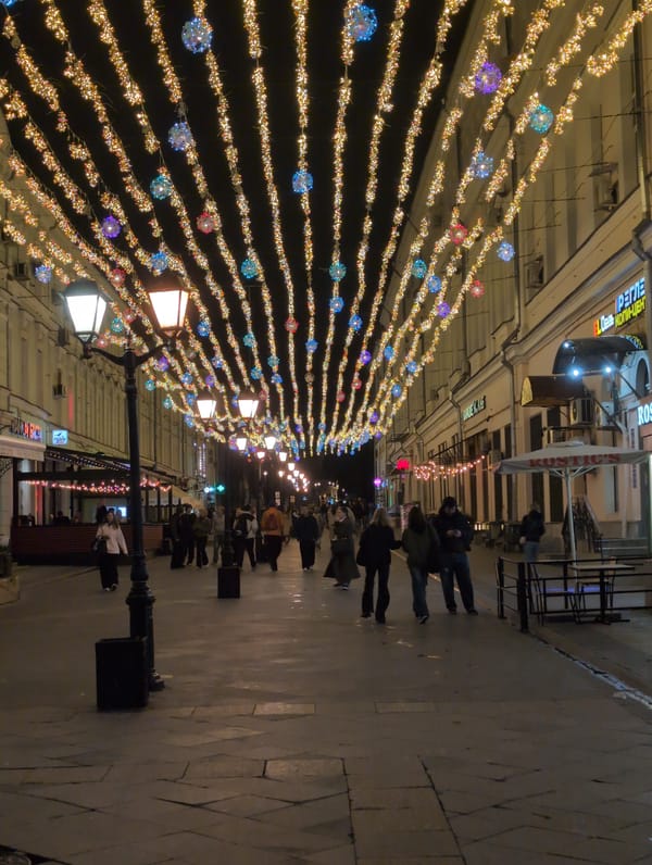 Christmas lights illuminate Moscow's Kamergersky Lane in May evening