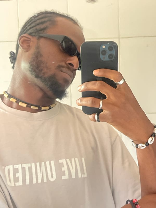 Man photographed twice in Jos wearing Live United shirt