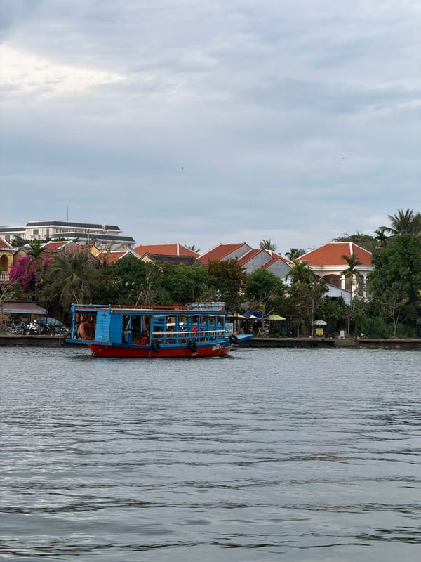 Vietnamese river boat tours feature traditional lantern painting activities