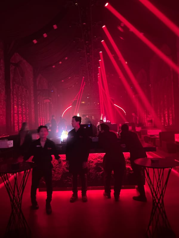 MU:IN Bali nightclub mid-show: costumed stage performance, red lights, full venue
